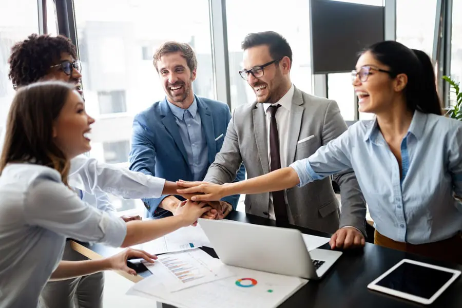 Commercial-Umbrella-Insurance-Co-Workers-Cheering-Over-a-Deal-min