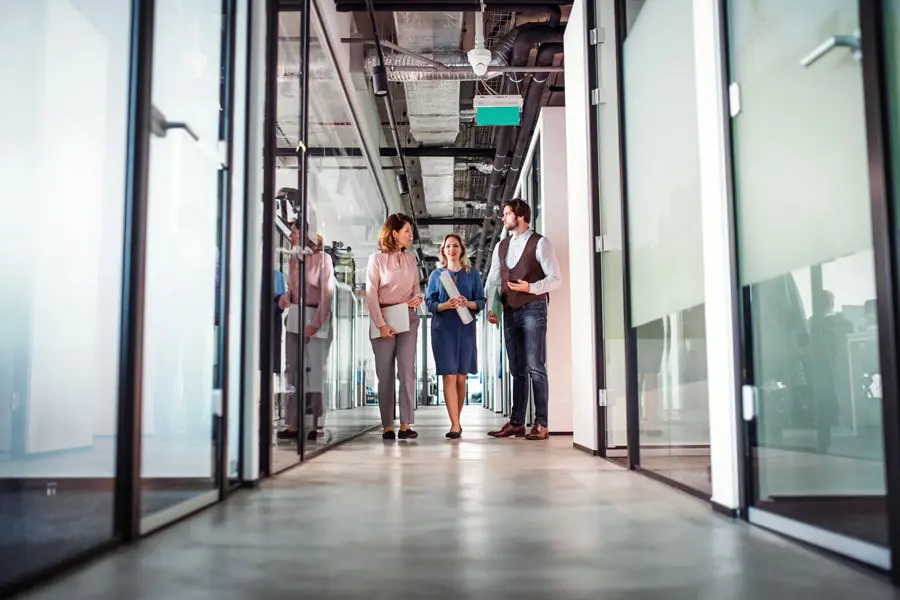 General-Liability-Office-Hallway-of-Employees-Standing-and-Chatting-min