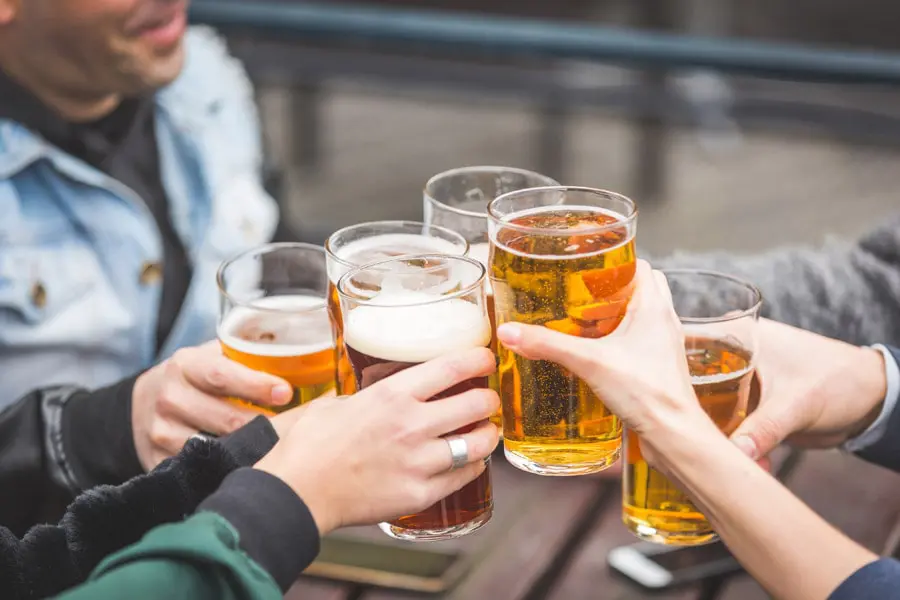 Liquor-Liability-Insurance-Group-of-Friends-Cheering-with-a-Beer-min