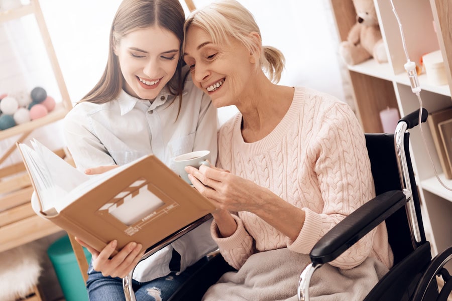 Long-Term-Care-Insurance-Grandmother-and-Child-Looking-at-Photo-Albums-min