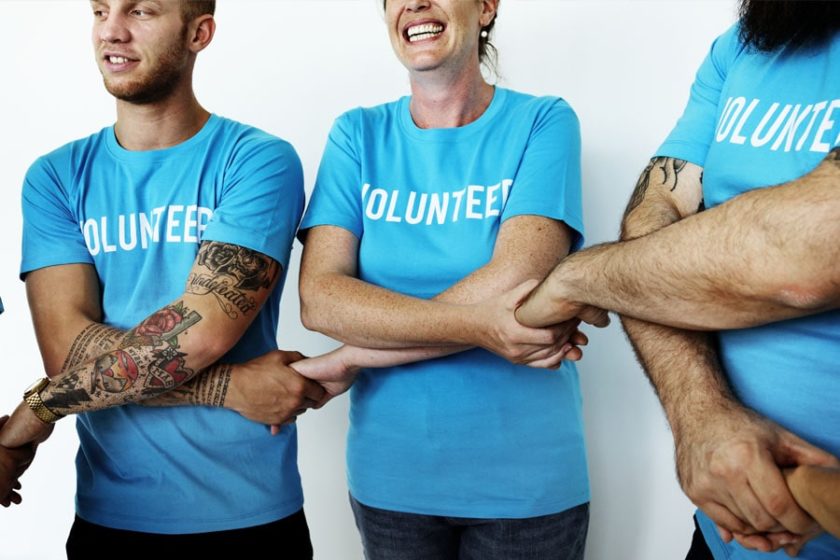 Non-Profit-Insurance-Volunteers-Holding-Hands-and-Embracing-min-e1597158473326